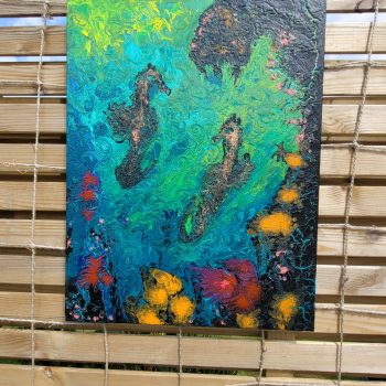 Seahorses playing amongst the coral